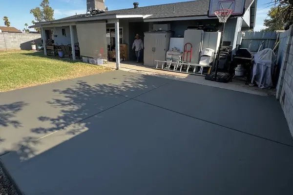 A large backyard concrete slab poured by our featured contractor