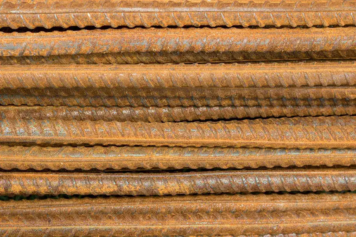 A stack of steel rebar for reinforcing a concrete pad