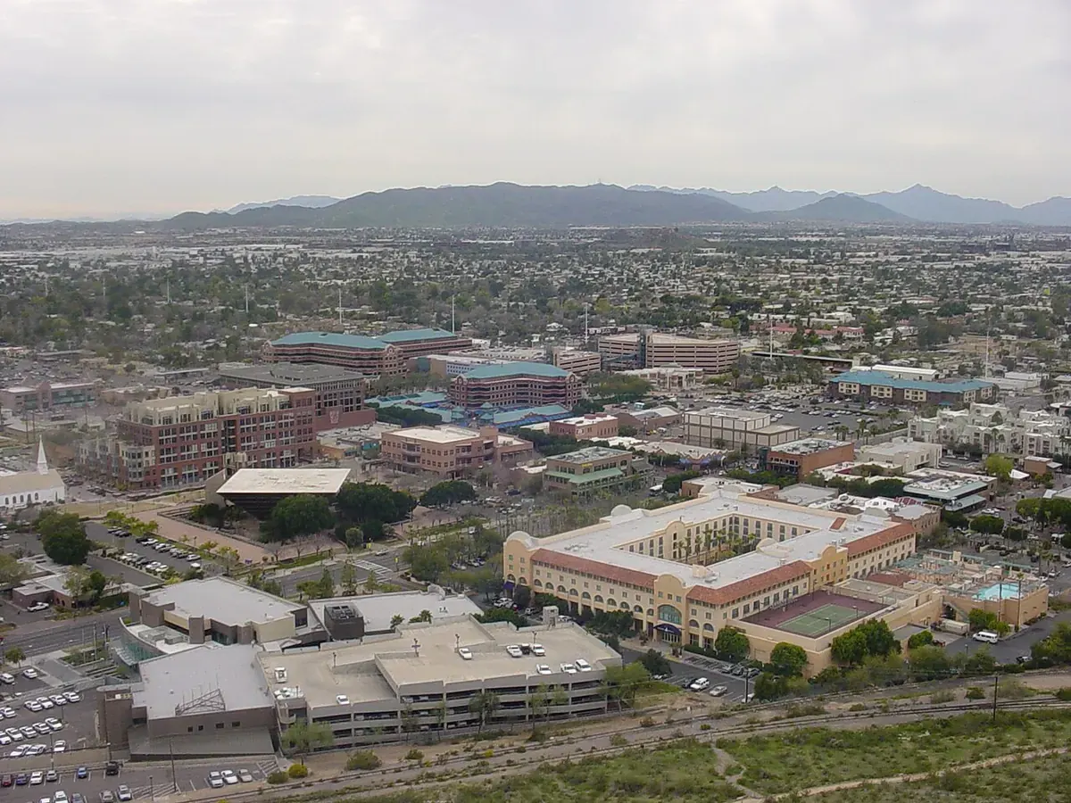 Aerial view of Tempe, Arizona with neighborhoods and mountains in the distance